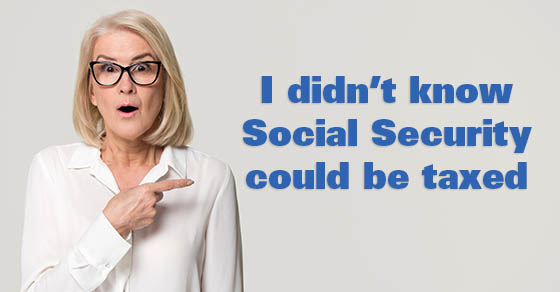 Surprised old mature businesswoman pointing finger at copy space looking at camera, amazed senior middle aged woman in glasses advertising product service isolated on white grey studio background